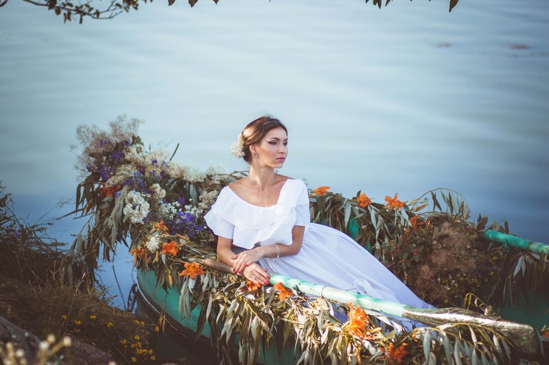 Woman in White Dress — Serene, Afternoon, Photograph, Boat, Flowers
