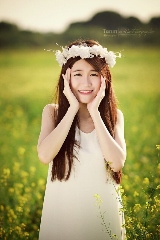 Woman in White Dress — Serene, Afternoon, Photograph, Flower Crown, Field, Yellow Flowers
