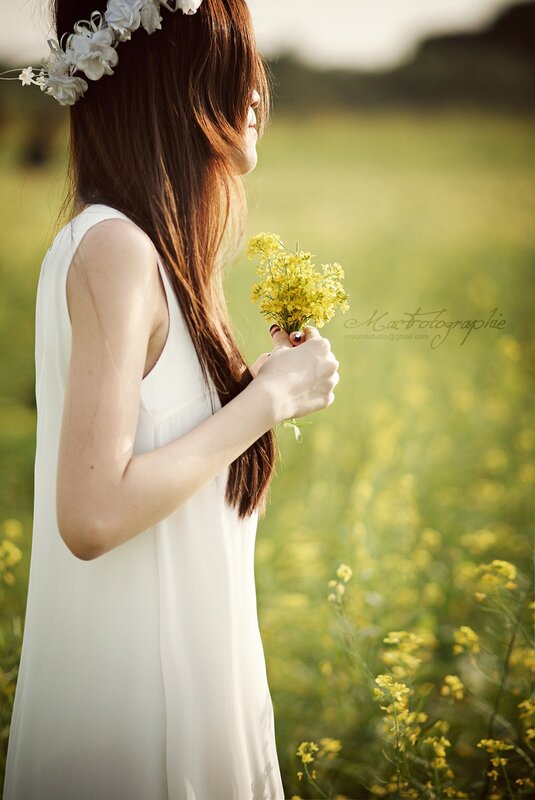 Woman in White Dress — Serene, Afternoon, Photograph, Flower Crown, Yellow Flowers, Field