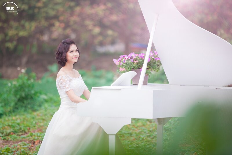 Woman in White Dress — Serene, Afternoon, Photograph, Piano, Flowers