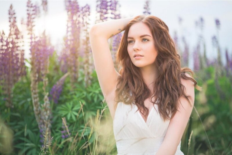Woman in White Dress — Serene, Afternoon, Photograph, Purple Flowers