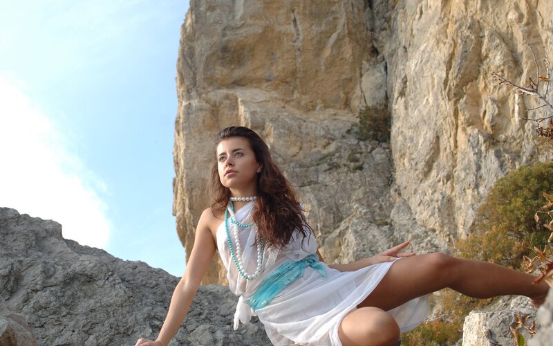 Woman in White Dress — Serene, Afternoon, Photograph, Rocks, Sky, Necklace