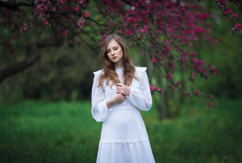 Woman in White Dress — Serene, Spring, Photograph, Flowering Tree, Grass