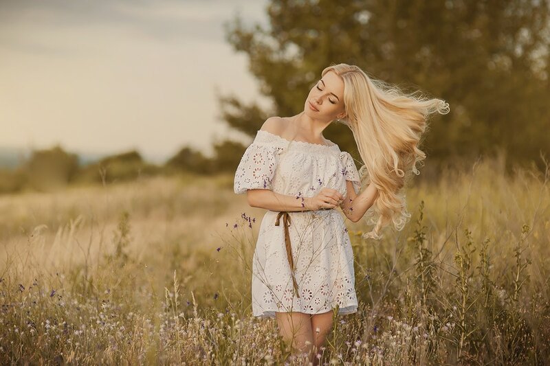 Woman in White Dress — Serene, Sunset, Photograph, Field, Flowers, Trees