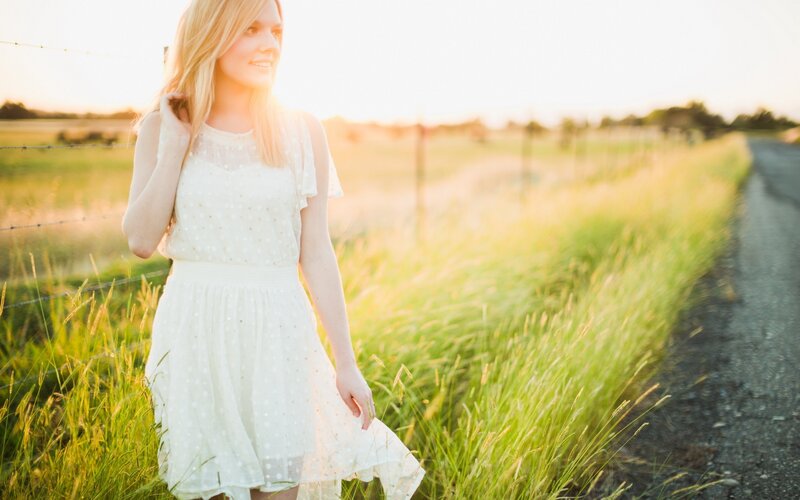 Woman in White Dress — Serene, Sunset, Photograph, Field, Road, Fence, Green