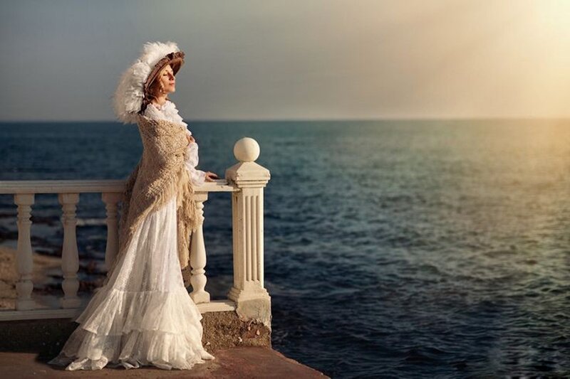 Woman in White Dress — Serene, Sunset, Photograph, Ocean, Balustrade