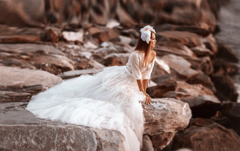 Woman in White Dress — Serene, Sunset, Photograph, Rocks, Flower Crown