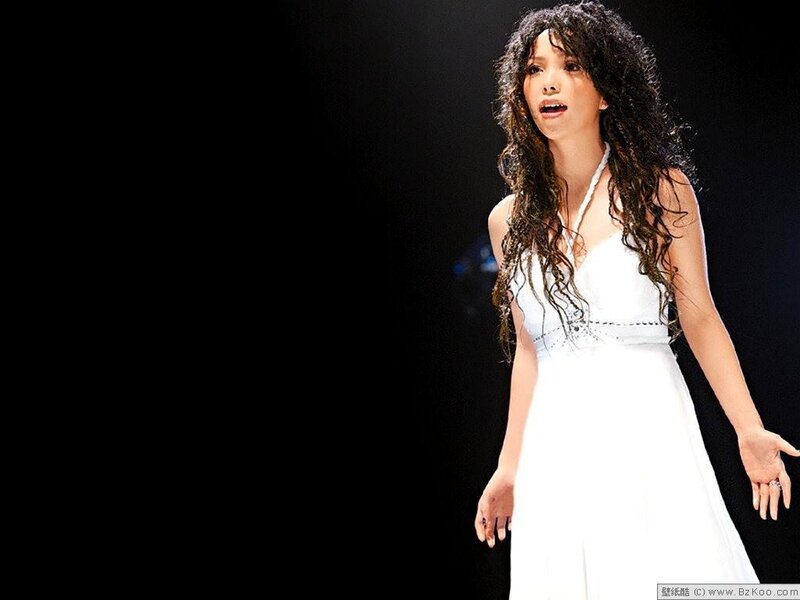 woman in white dress singing