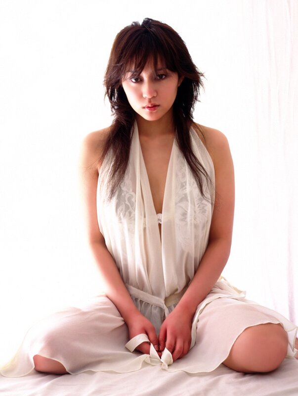 woman in white dress sitting