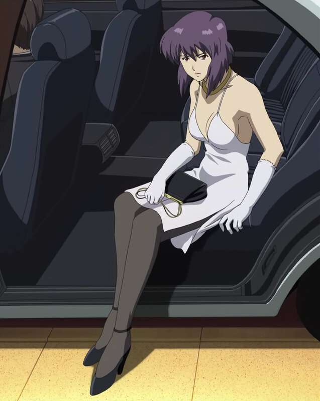 woman in white dress sitting in car