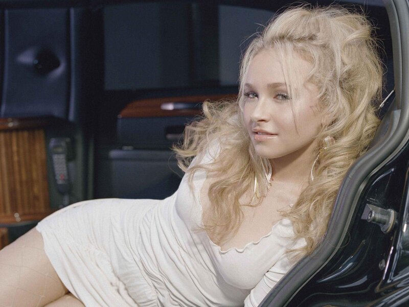 woman in white dress sitting in car
