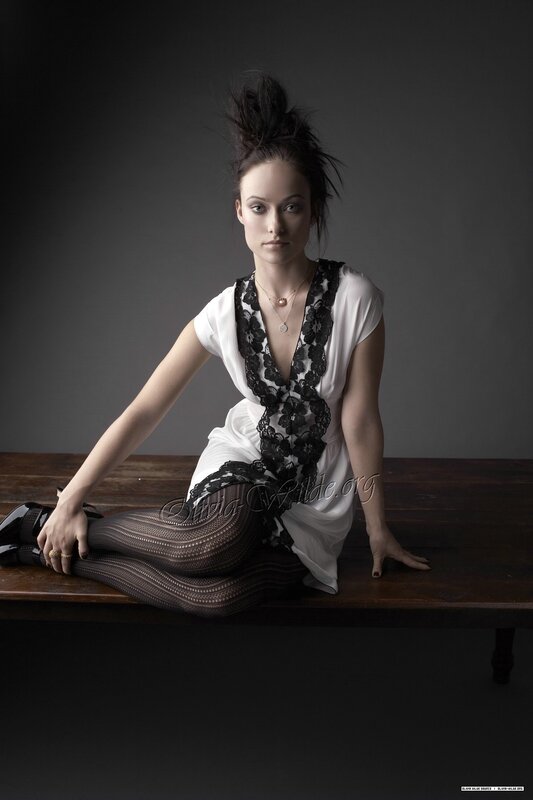 woman in white dress sitting on table