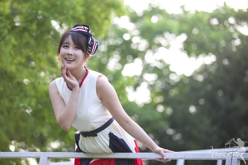 woman in white dress smiling