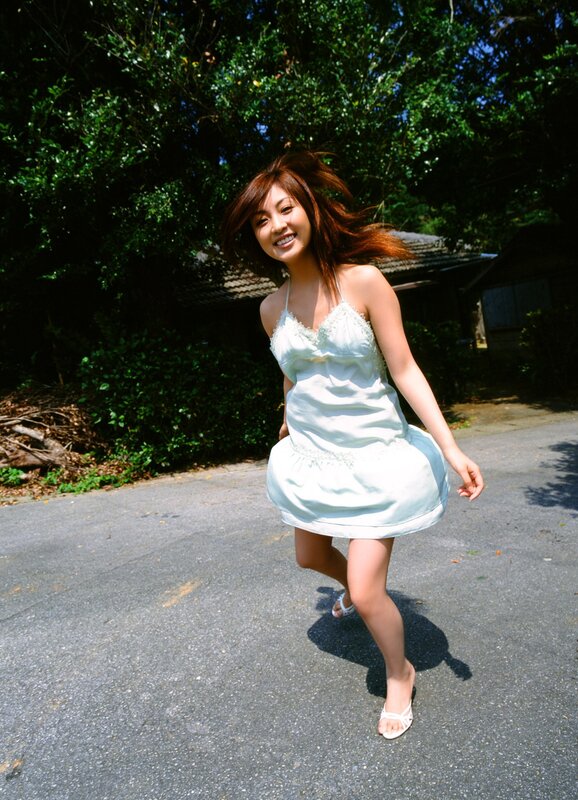 Woman in white dress smiling
