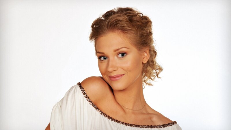 woman in white dress smiling