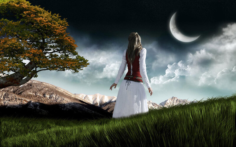 Woman in white dress under moonlight