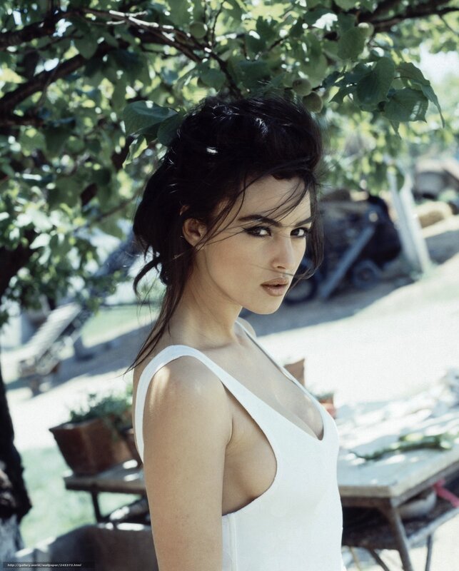 Woman in white dress under tree