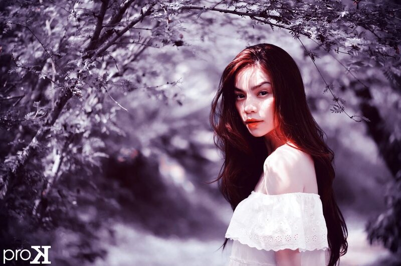 woman in white dress under trees