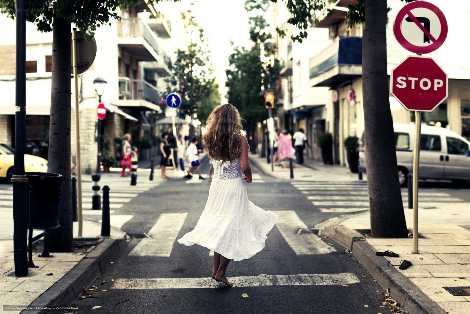 Woman in white dress walking