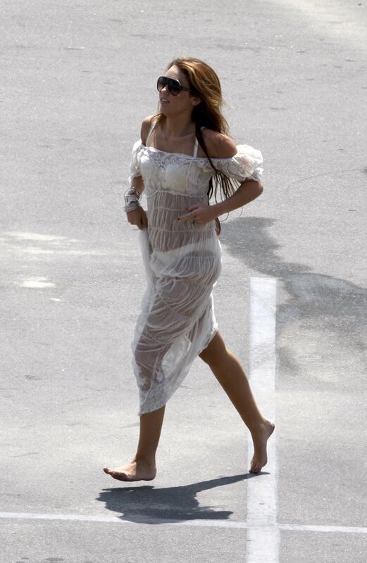 woman in white dress walking