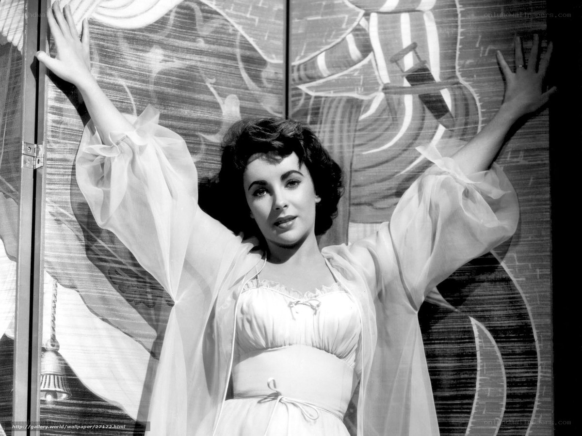 Woman in white dress with arms raised