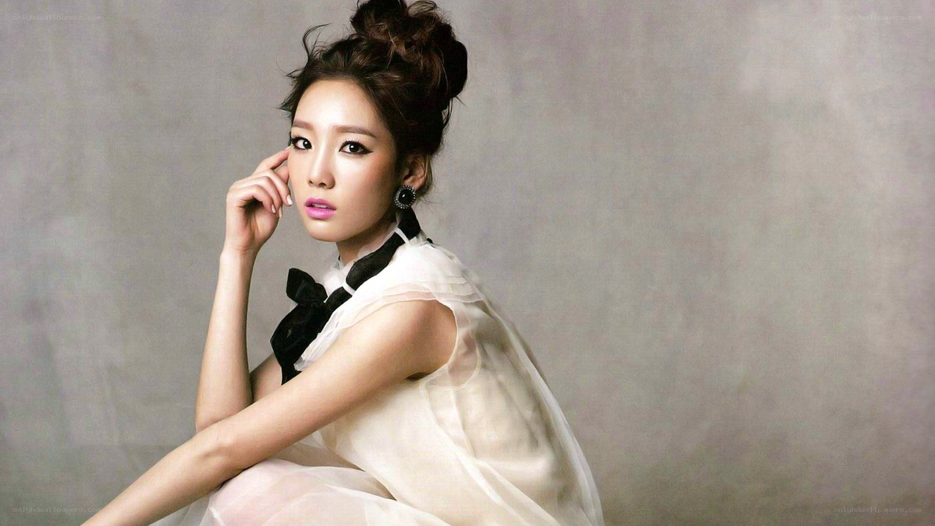 woman in white dress with black bow