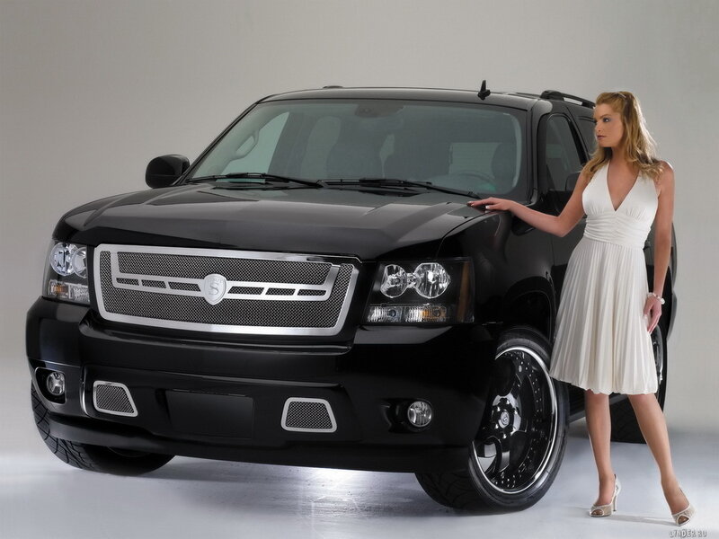 woman in white dress with black suv