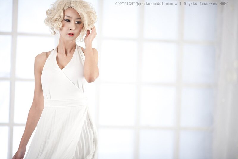 woman in white dress with blonde wig