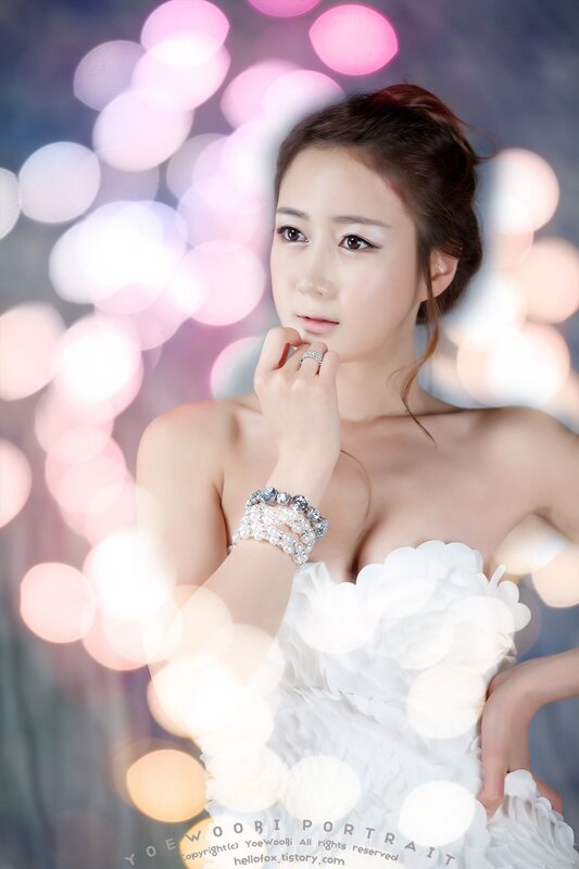 woman in white dress with bokeh lights