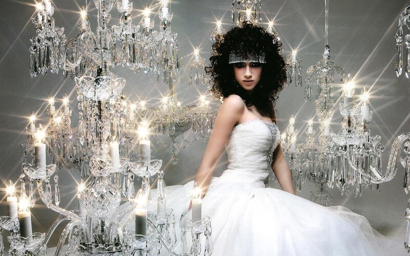 woman in white dress with chandeliers