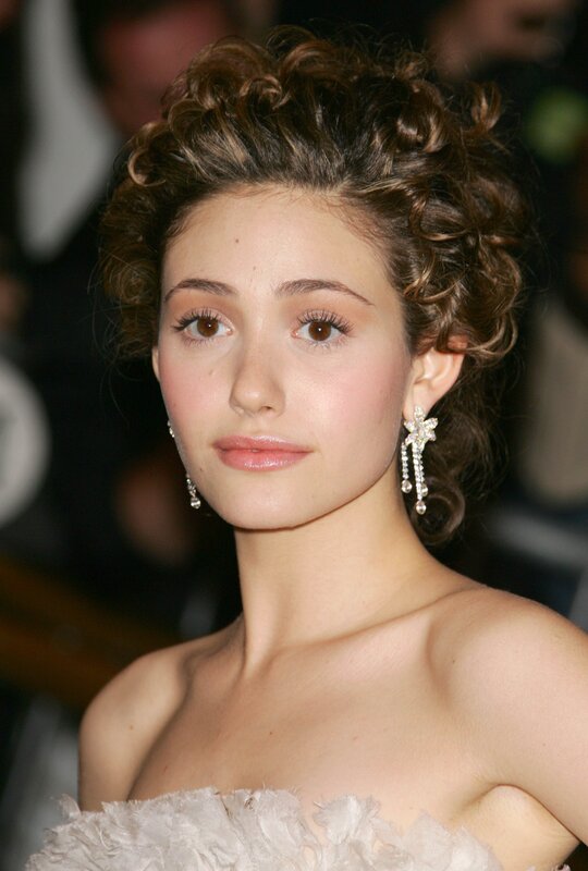 woman in white dress with curly hair