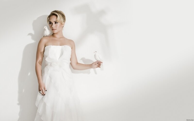 woman in white dress with doves