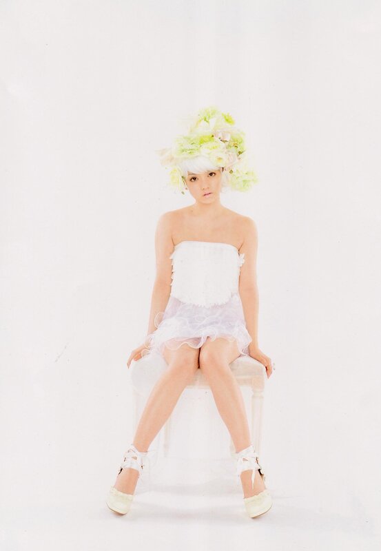 woman in white dress with floral headpiece