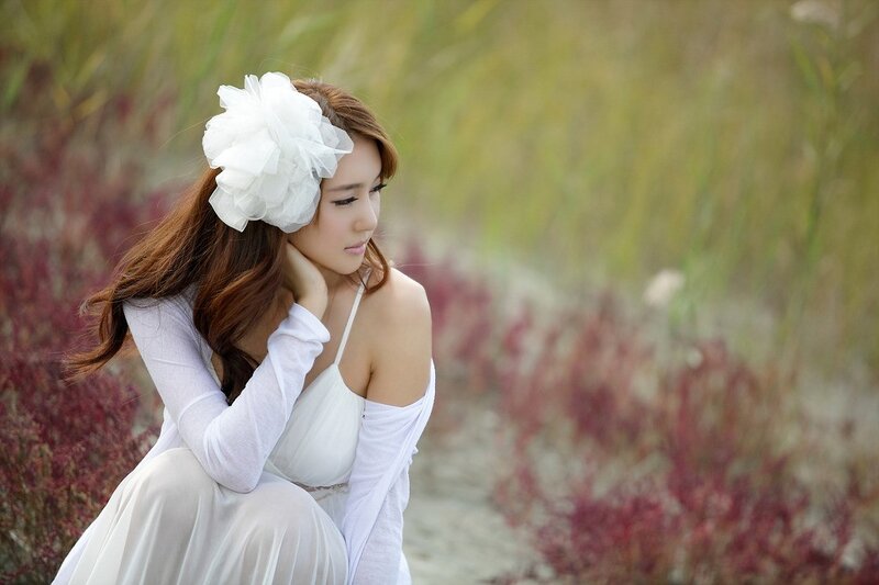 woman in white dress with flower