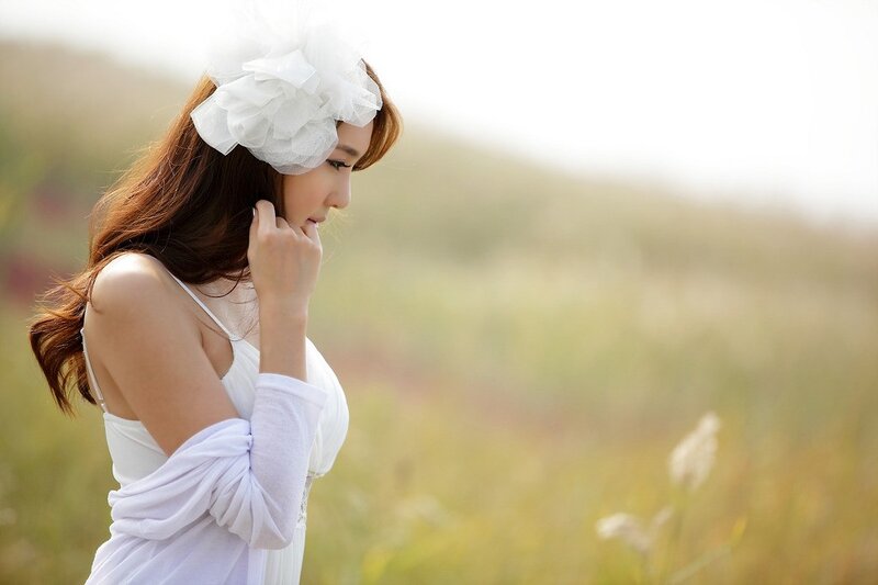 woman in white dress with flower