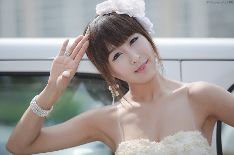 woman in white dress with flower crown