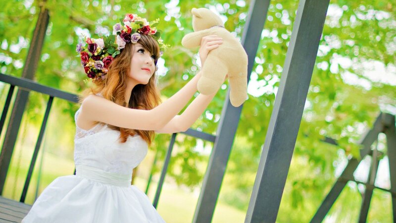Woman in white dress with flower crown