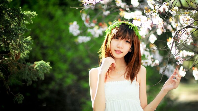 woman in white dress with flower crown