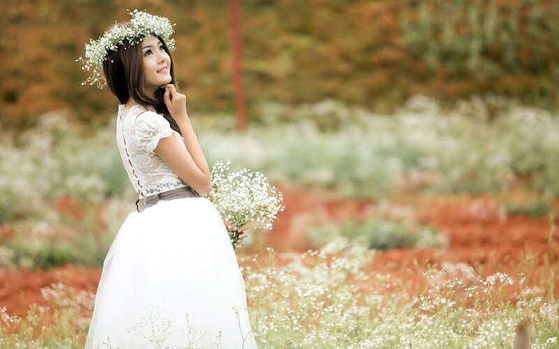 Woman in white dress with flower crown