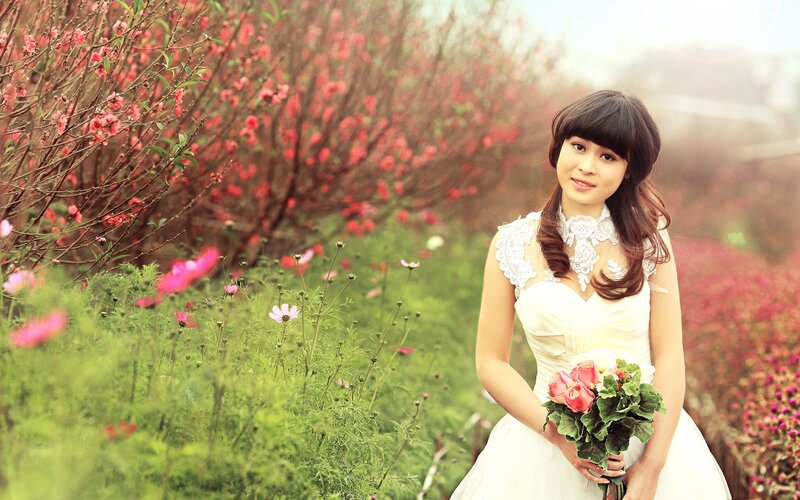 Woman in white dress with flowers