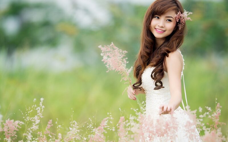 woman in white dress with flowers