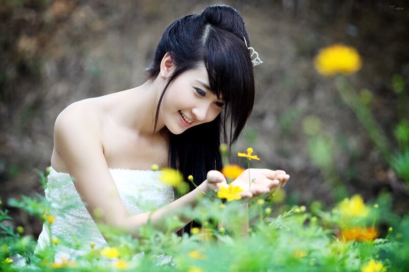woman in white dress with flowers