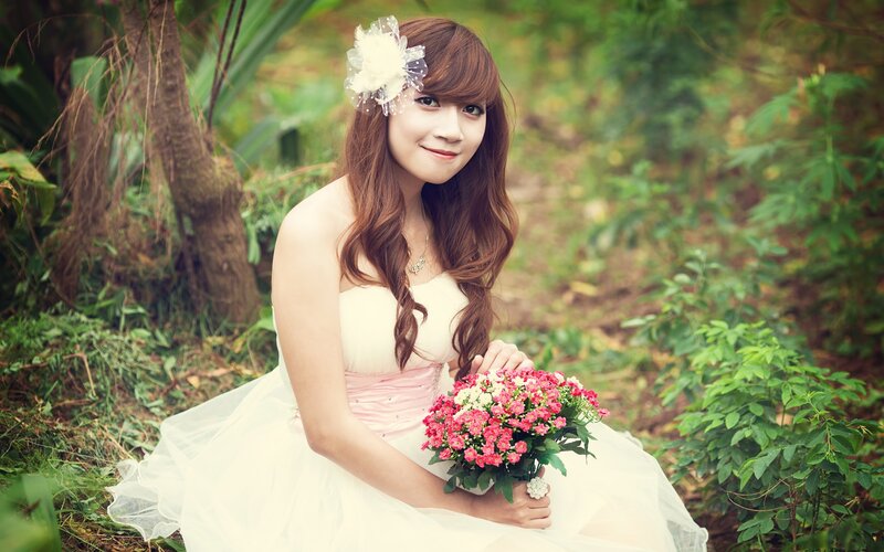 woman in white dress with flowers