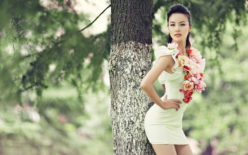 woman in white dress with flowers