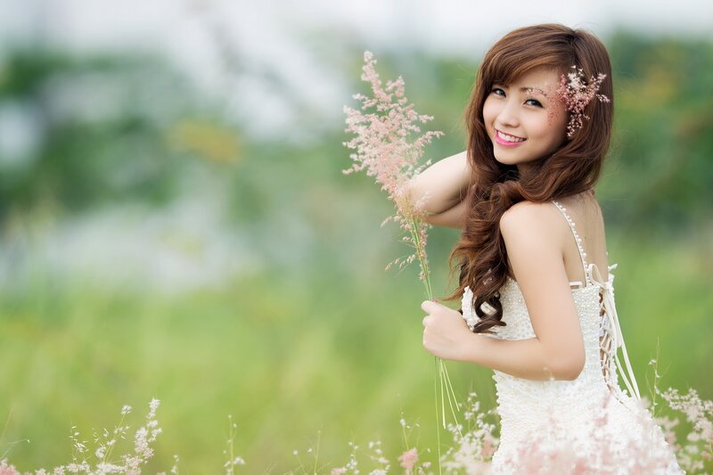 woman in white dress with flowers