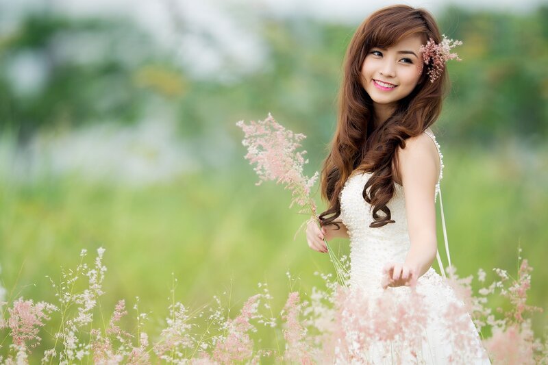 woman in white dress with flowers