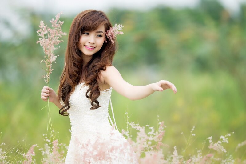 woman in white dress with flowers