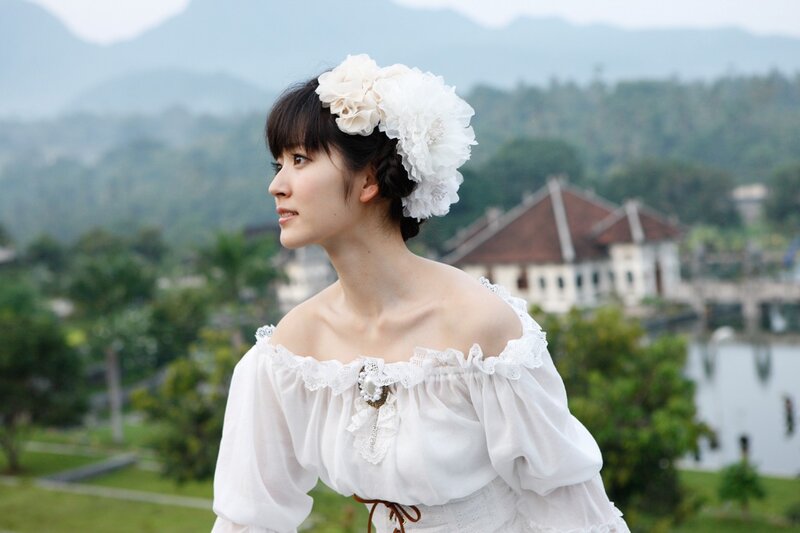 woman in white dress with flowers