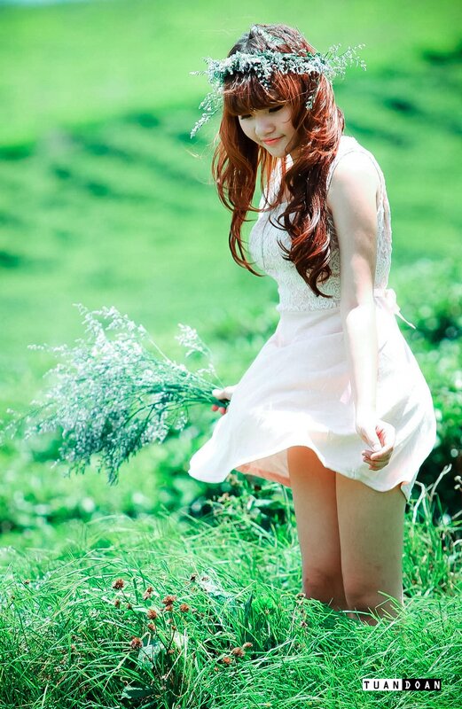 woman in white dress with flowers