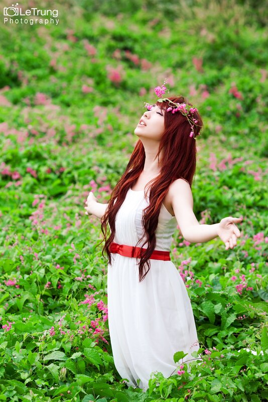 woman in white dress with flowers
